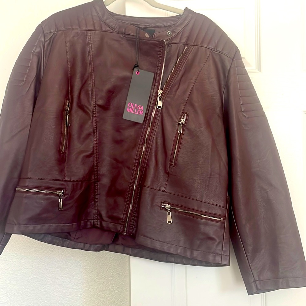 Never worn.  Burgundy-ish leather jacket.